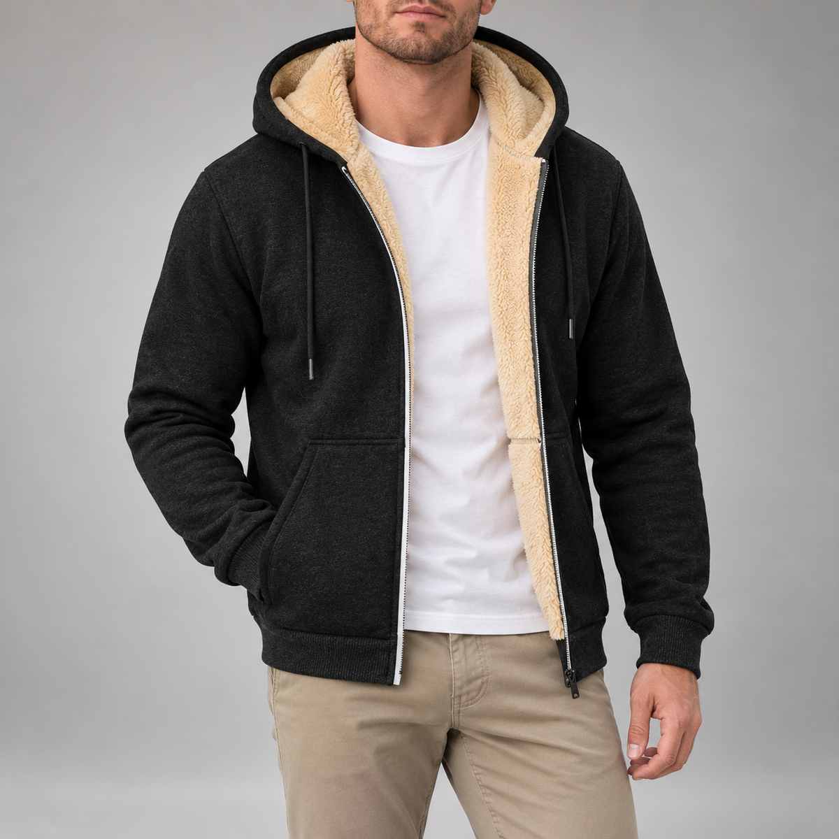 Sherpa-Lined Zip-Up Hoodie – Black hoodie worn by a male model with sherpa lining, kangaroo pockets and ribbed cuffs