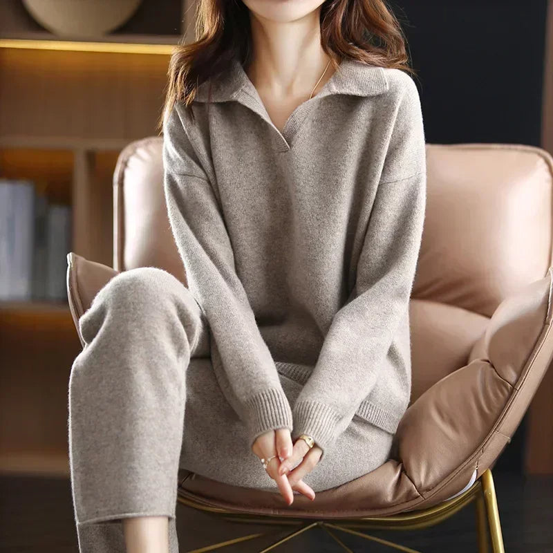 Taupe ribbed knit V-neck sweater with a folded collar, long sleeves, and structured cuffs in a hip-length straight fit.