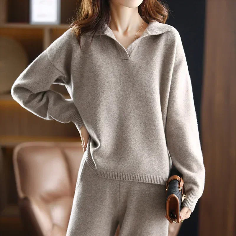 Beige collared V-neck sweater in a soft knit with long sleeves, ribbed cuffs, and a straight-cut hip-length silhouette.