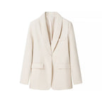 Cream tailored blazer with a soft shawl lapel, single-button closure, and structured flap pockets in smooth fabric.