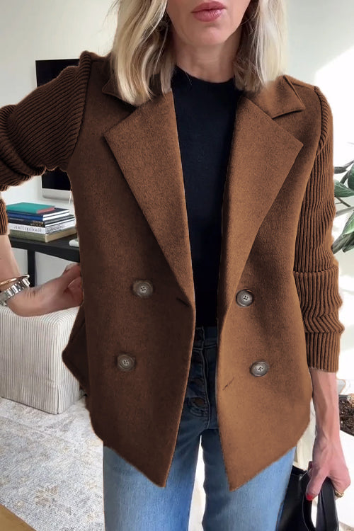 Brown wool-blend double-breasted blazer with contrasting ribbed-knit sleeves and a tailored, structured silhouette.
