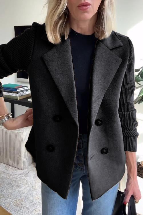 Charcoal wool-blend double-breasted blazer featuring contrasting ribbed-knit sleeves and a tailored silhouette.