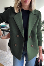 Double-breasted forest green wool-blend blazer featuring contrasting ribbed-knit sleeves and a tailored fit.