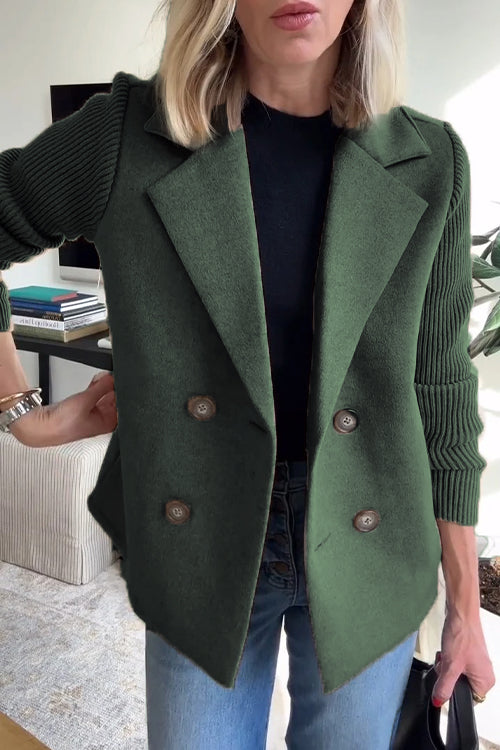 Double-breasted forest green wool-blend blazer featuring contrasting ribbed-knit sleeves and a tailored fit.