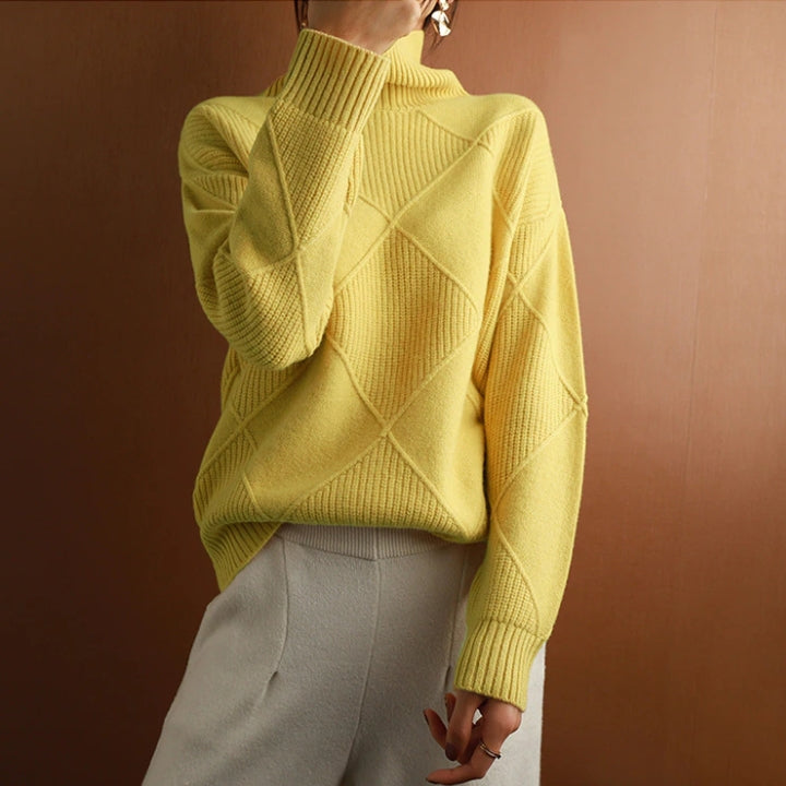 Yellow wool turtleneck sweater featuring a raised diamond-pattern knit, ribbed cuffs, and a relaxed, comfortable fit.