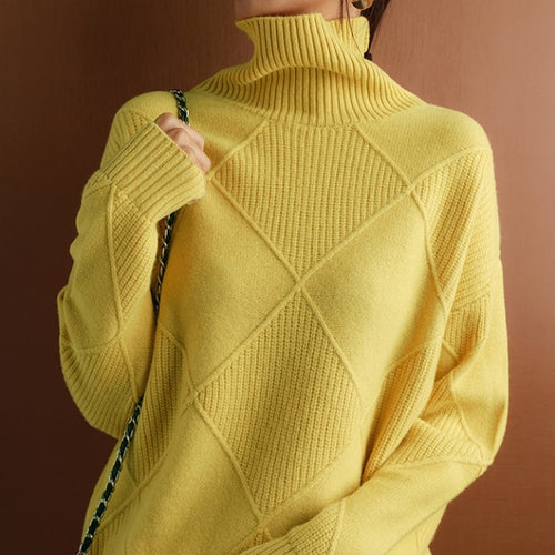 Yellow wool turtleneck sweater featuring a raised diamond-pattern knit, ribbed collar, and cuffs in a relaxed fit.
