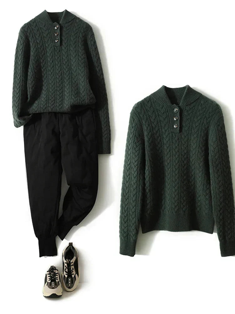 Dark green wool-blend cable-knit henley sweater with a buttoned stand collar, styled with black trousers and sneakers.
