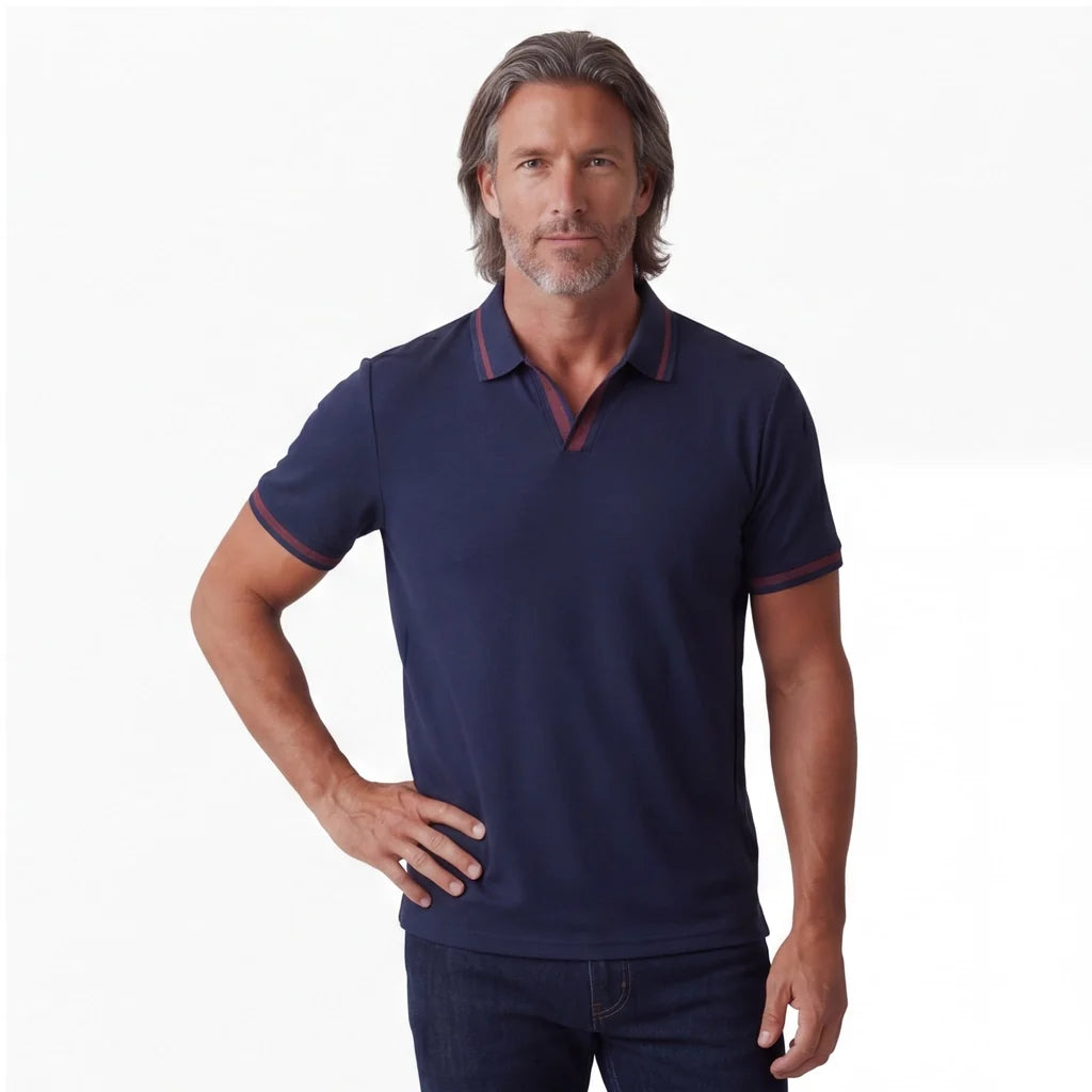 Close-up of a man wearing a navy short-sleeve polo shirt with a classic collar and button placket.