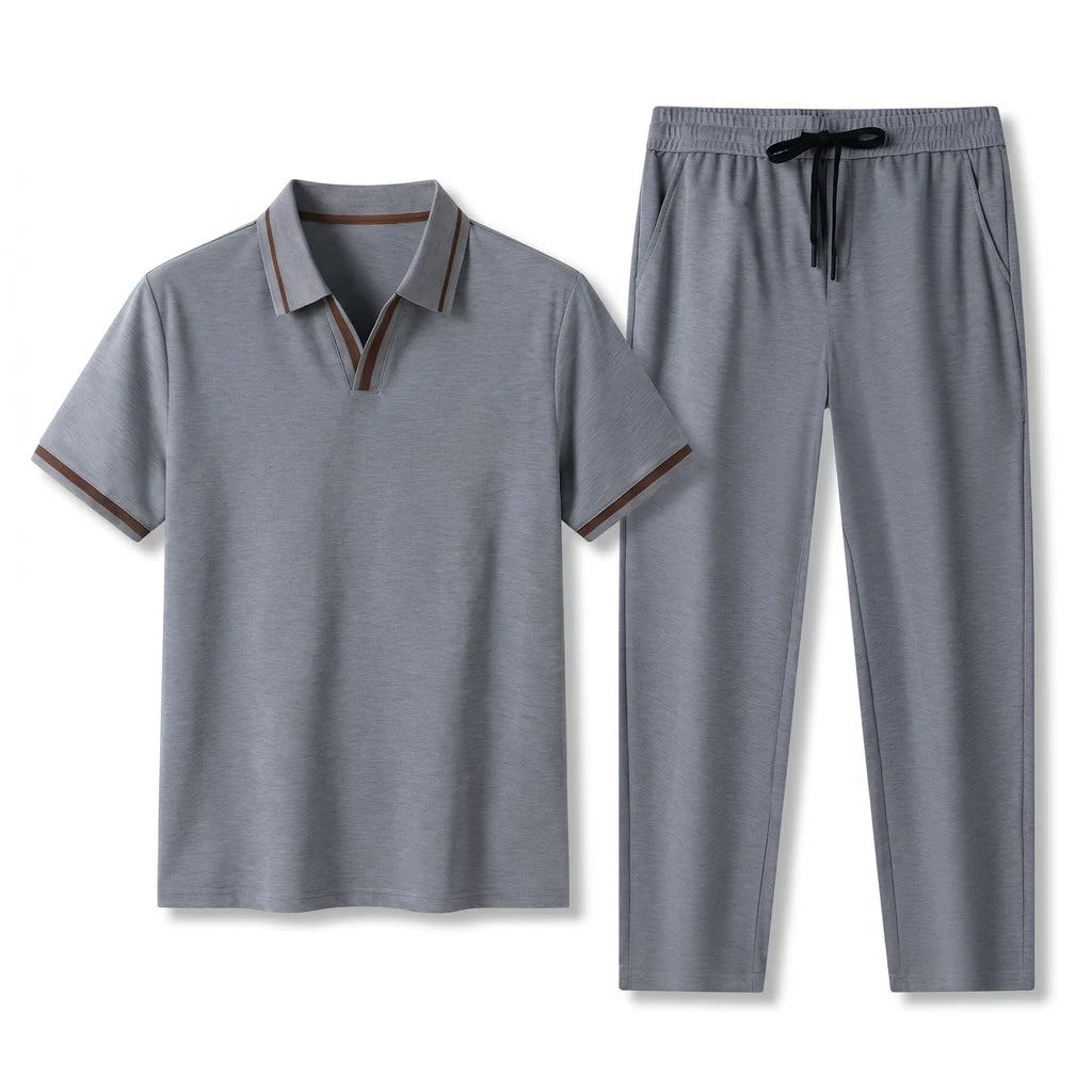 Men's navy short-sleeve polo shirt paired with matching drawstring pants displayed as a smart casual two-piece set.