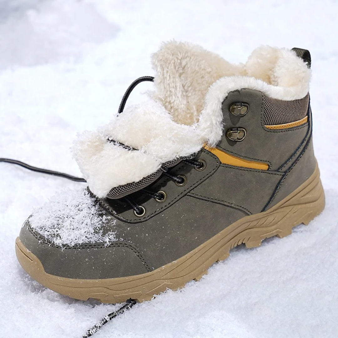 Gray vegan leather snow boot for men in fresh snow, showing the thick fleece collar lining