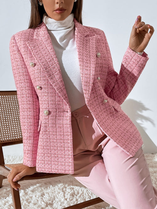 Pink tweed double-breasted blazer with notched lapels and decorative buttons, worn over a white turtleneck.
