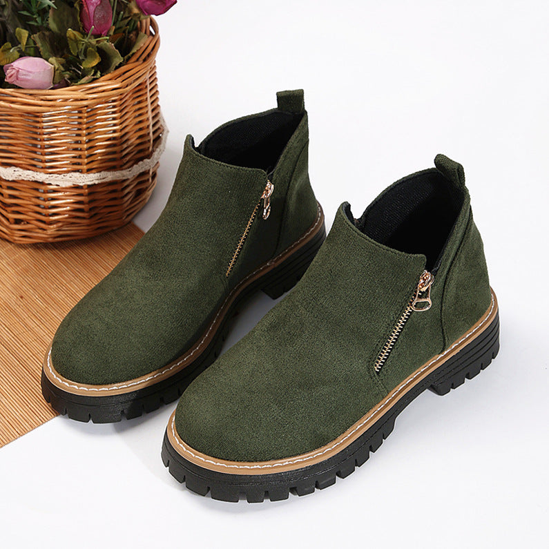 Olive green brushed-finish ankle boots with side zips, round toes, and chunky black notched tread platform soles.