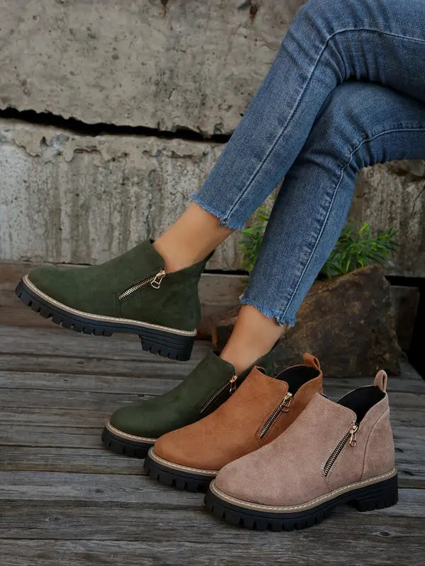 Brushed suede ankle boots with side zips and notched tread platform soles in olive, tan, and taupe.
