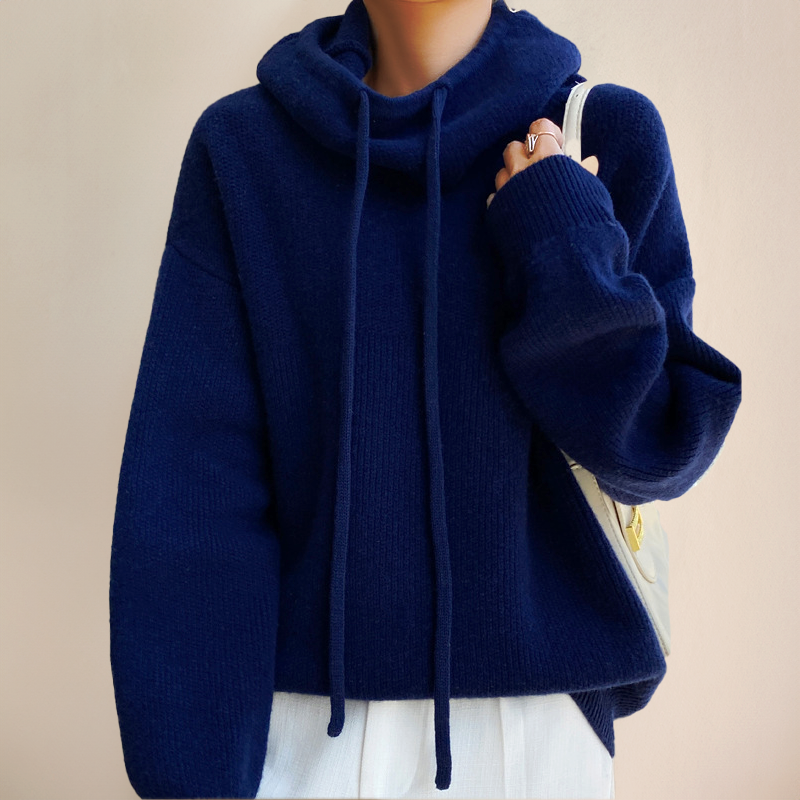 Oversized navy blue ribbed knit hooded sweater with a drawstring hood and dropped shoulders.