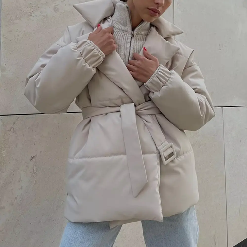 Beige belted wrap puffer jacket with notch lapels, quilted padding, and elastic cuffs cinched at the waist.