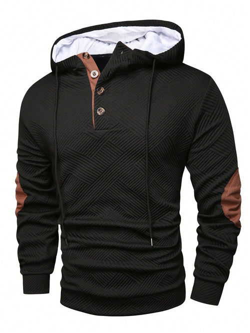 Black waffle knit pullover hoodie with a button placket, contrast drawstrings, and long sleeves on a white background.