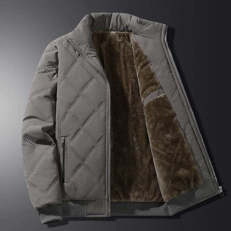 Men's gray quilted insulated jacket featuring a fleece-lined interior, stand collar, and full-zip closure.