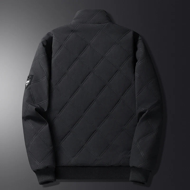 Back view of a men's black quilted insulated jacket with a diamond-stitched pattern and stand collar.