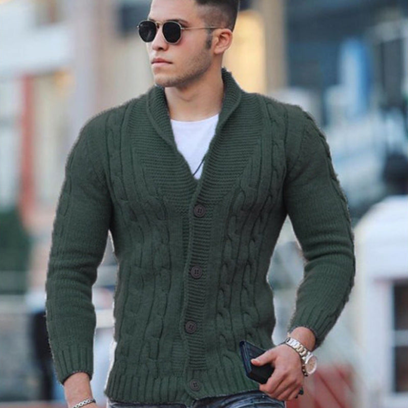 Olive green cable knit cardigan with a shawl collar, button-front closure, and ribbed cuffs worn over a white tee.