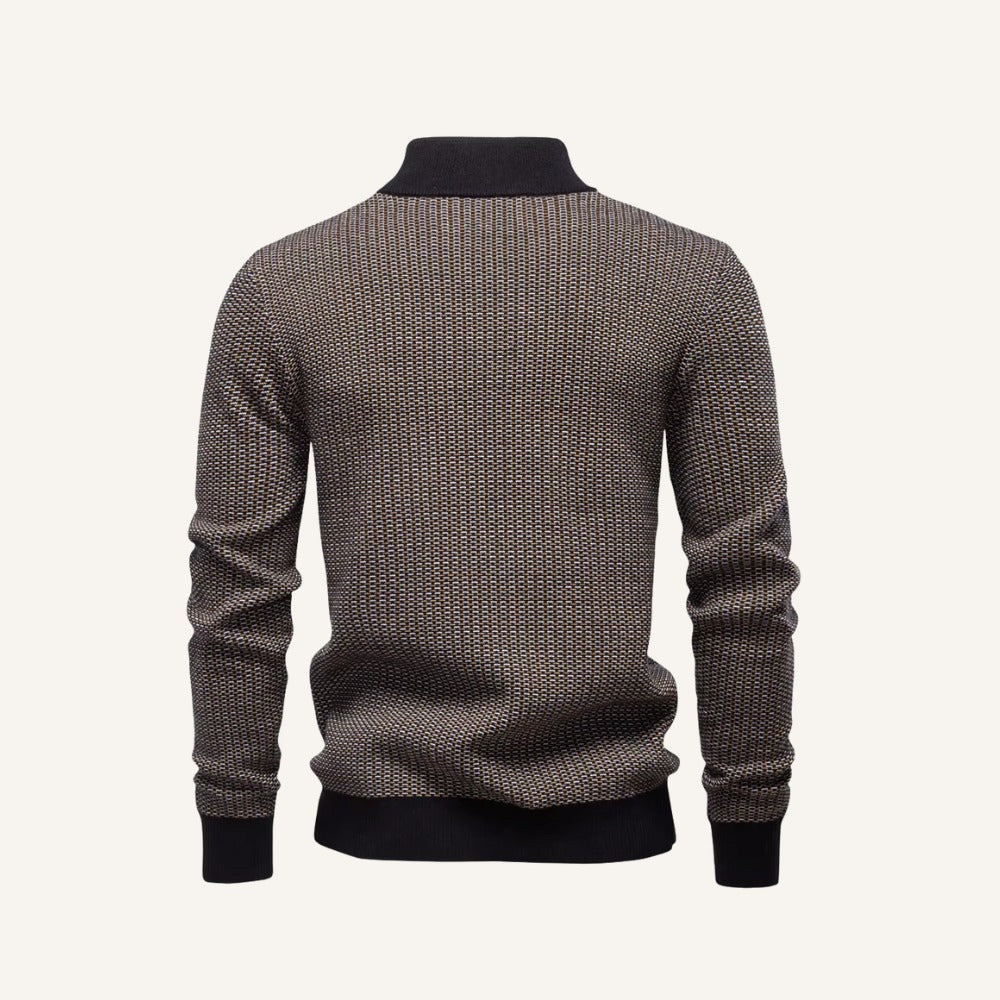 Back view of a birdseye knit quarter zip sweater featuring a textured brown pattern, stand collar, and ribbed trim.