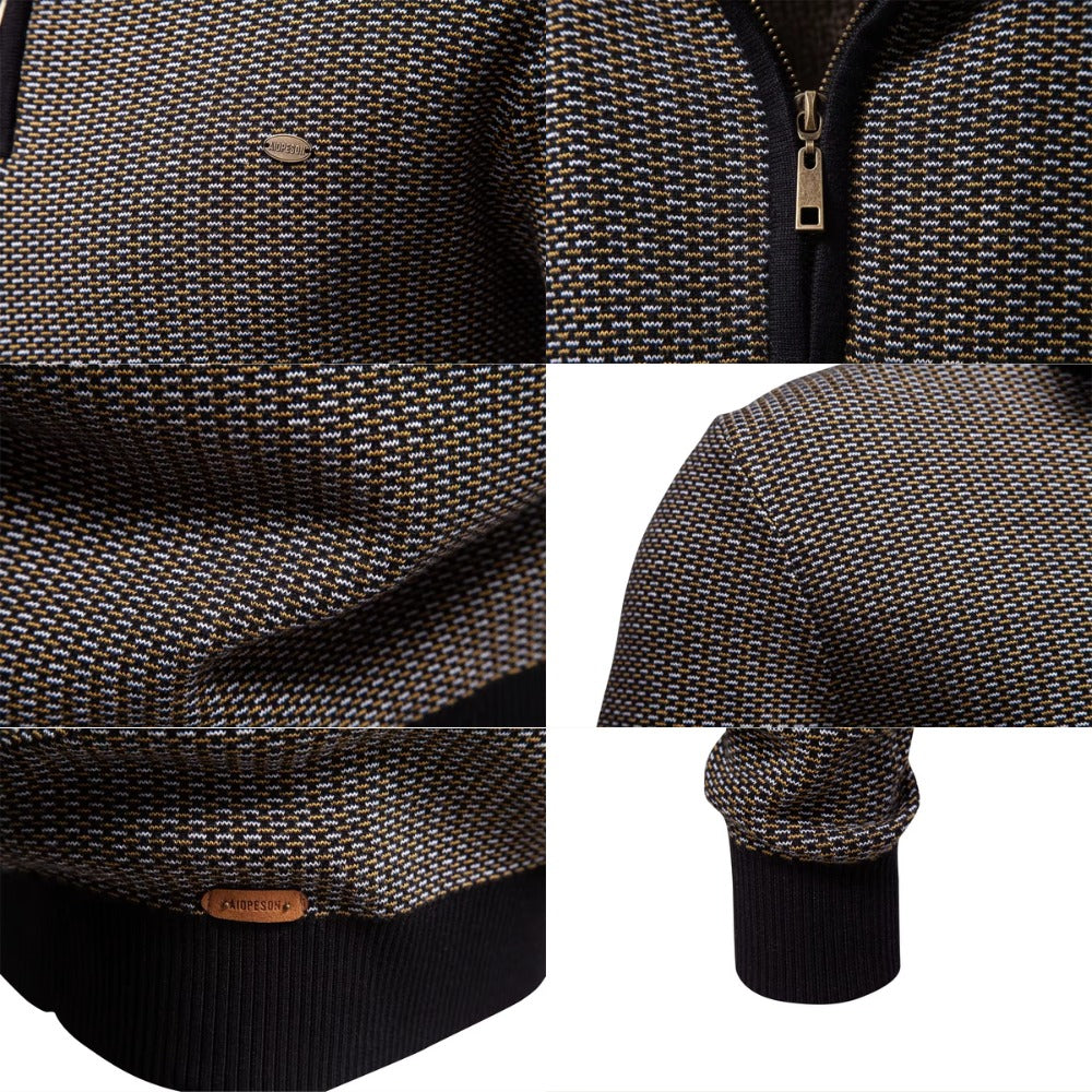 Birdseye knit quarter zip sweater in a flecked texture with a stand collar, ribbed cuffs, and hem in a regular fit.
