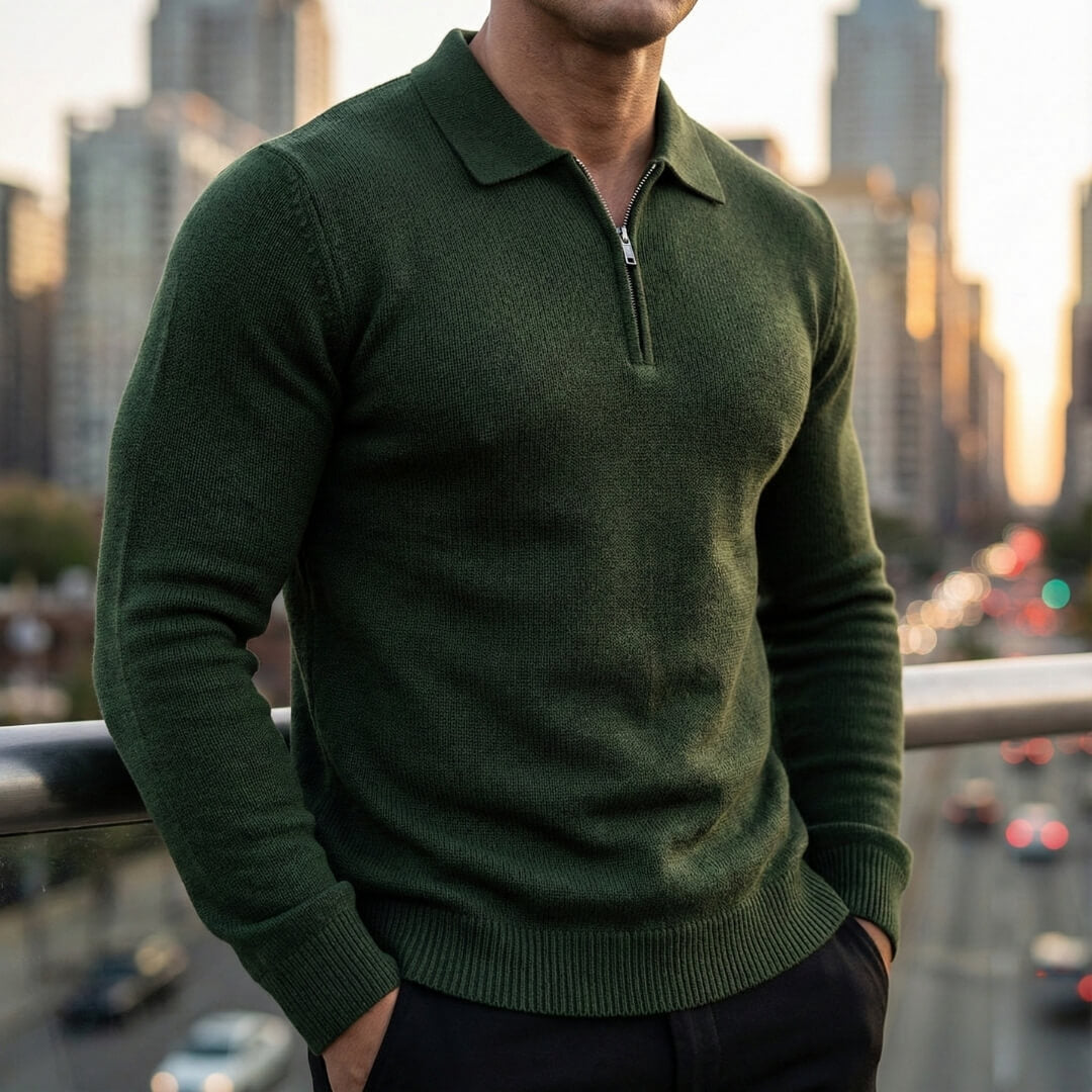 Forest green quarter-zip knit polo sweater featuring a ribbed collar and long sleeves, paired with dark trousers outdoors.