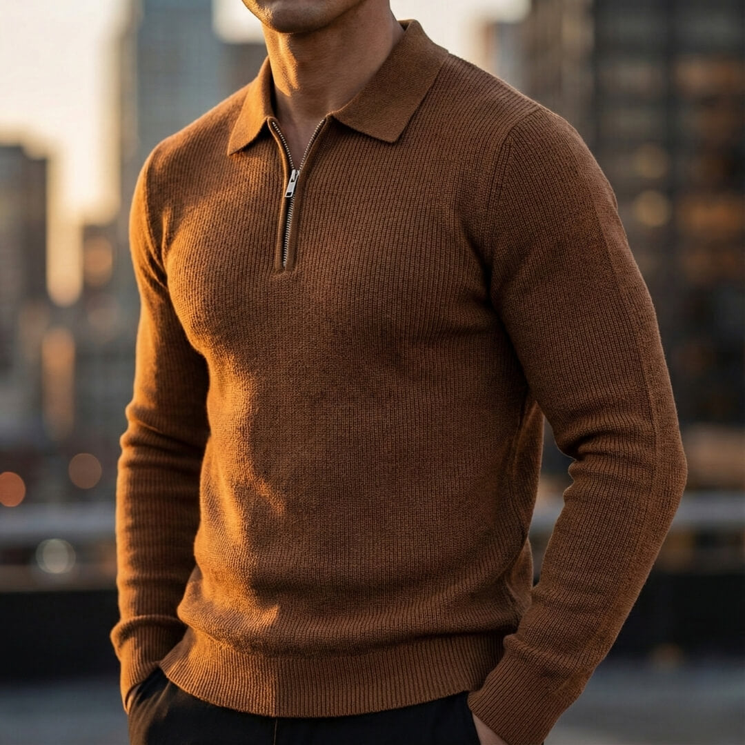 Brown quarter-zip knit polo sweater featuring a ribbed collar and long sleeves, worn with dark trousers.