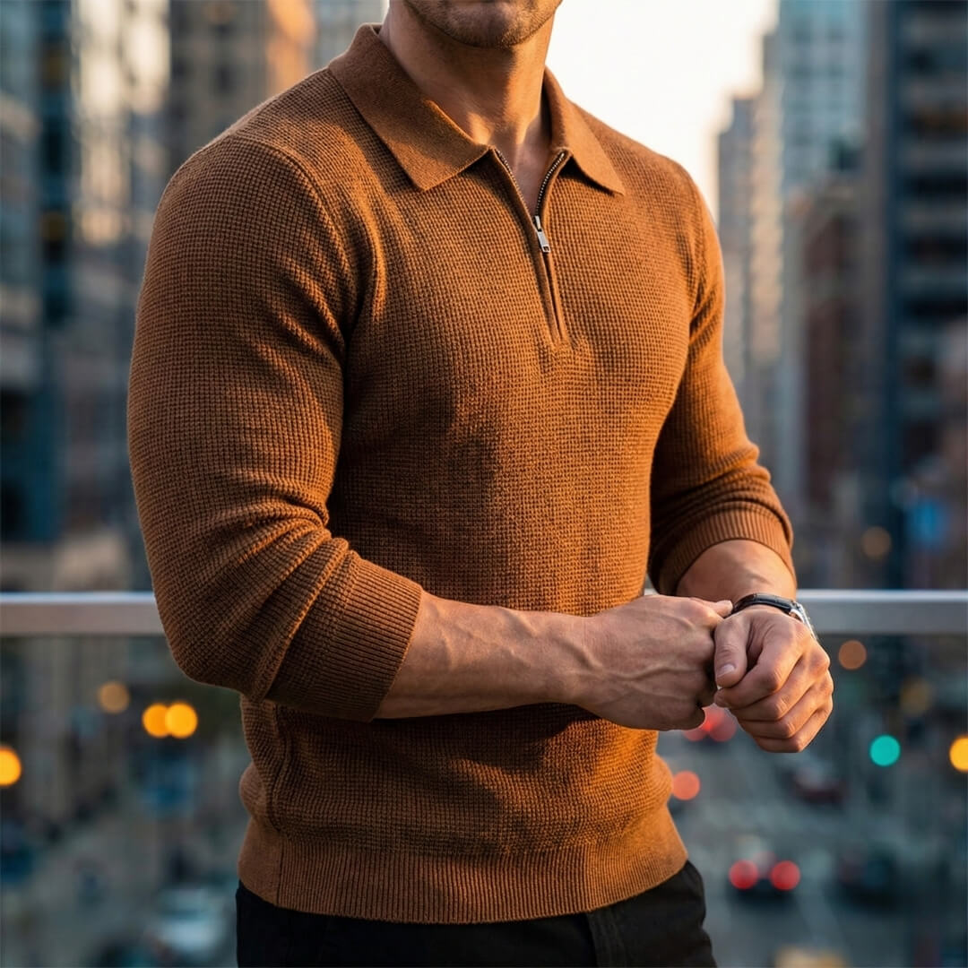 Brown quarter-zip knit polo sweater with a ribbed collar and long sleeves, shown in a three-quarter lifestyle view.