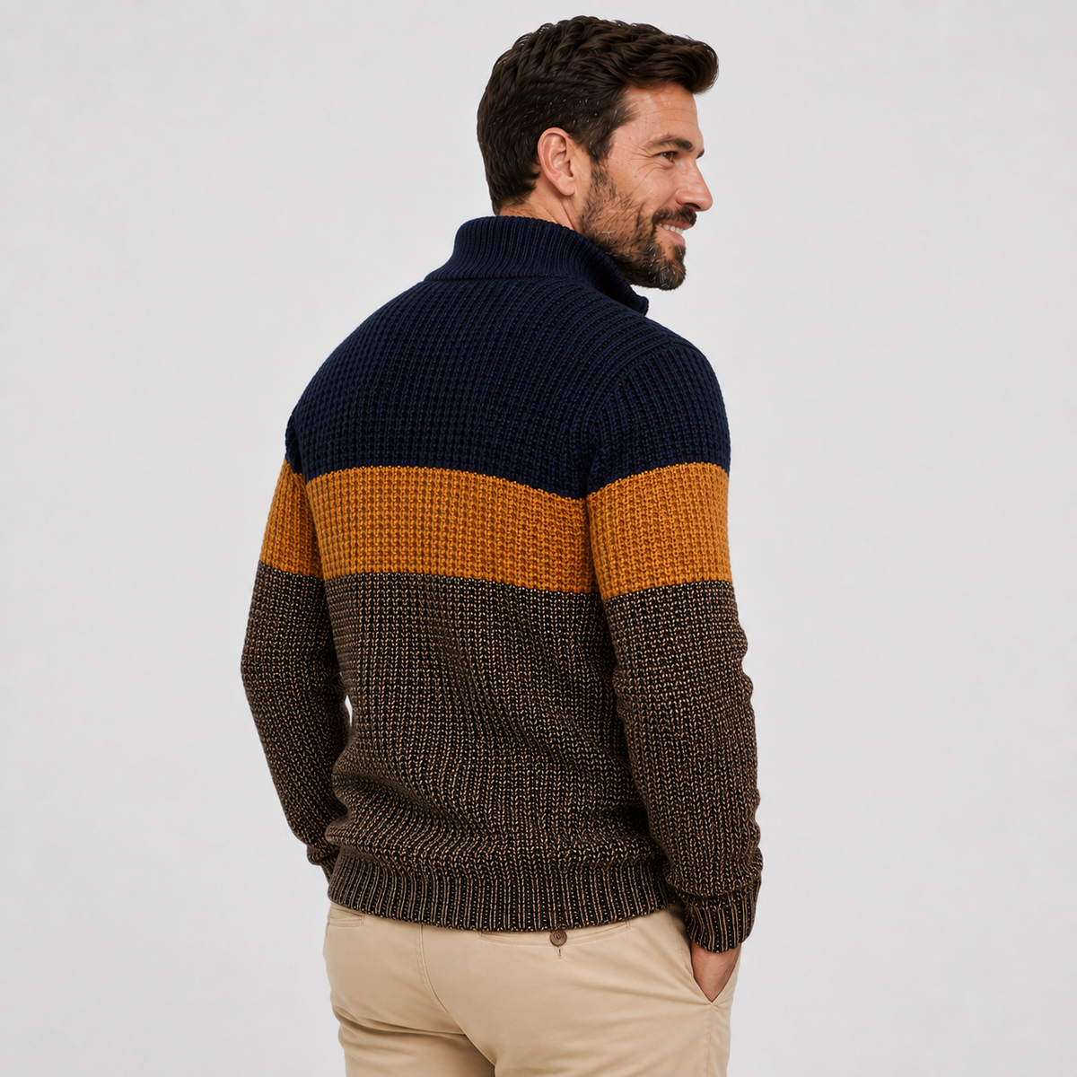 Navy, mustard, and brown colorblock quarter-zip sweater worn by a male model, shown from the side.