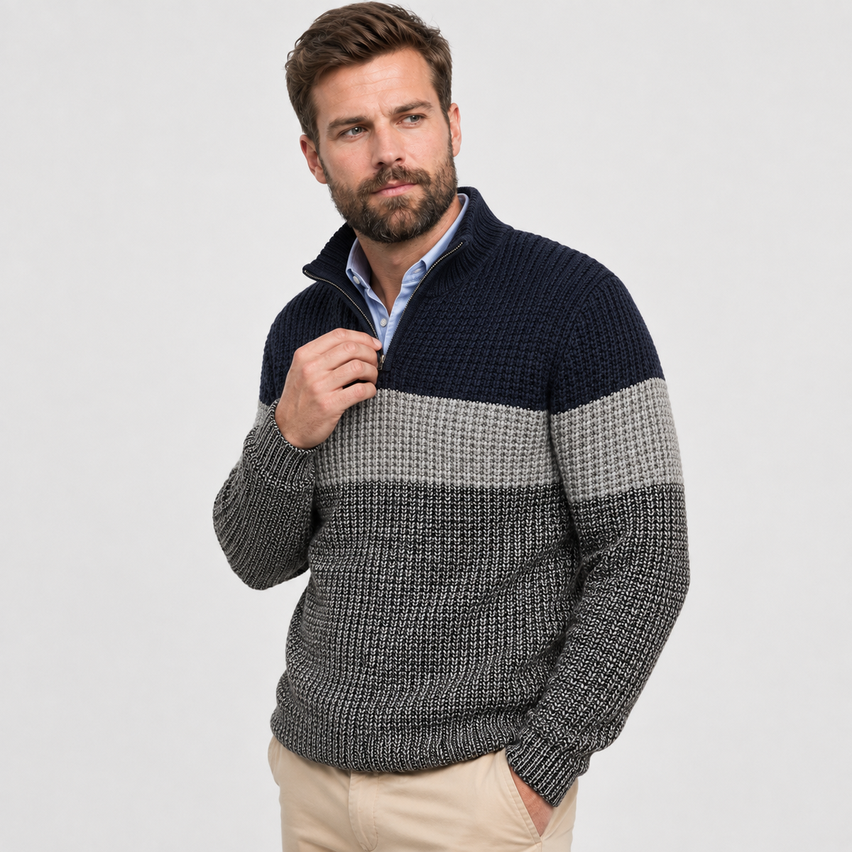 Navy and gray colorblock quarter-zip sweater worn by a male model, shown from the front.