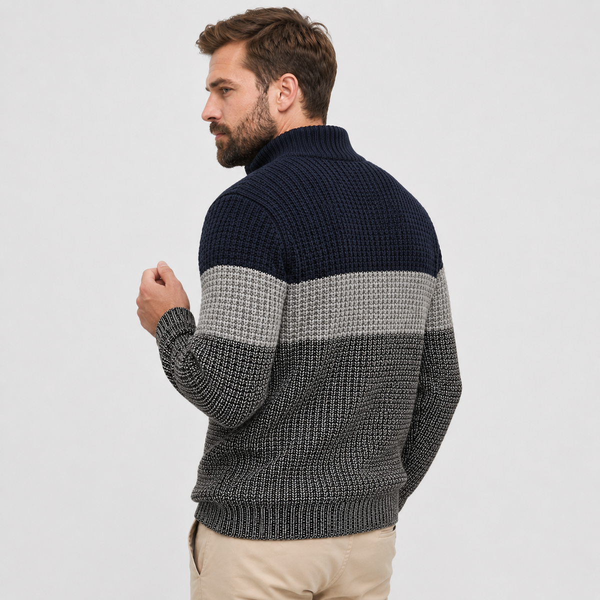 Navy, gray, and brown colorblock quarter-zip sweater worn by a male model, shown from the side.