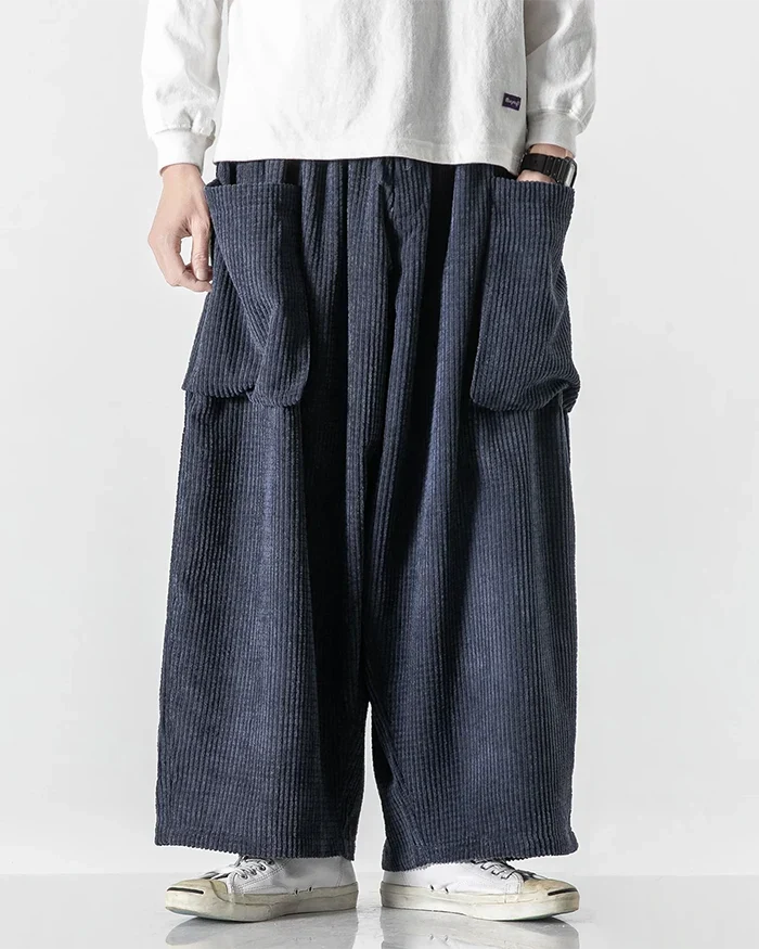 Navy corduroy cargo pants with large front pockets and elastic waist