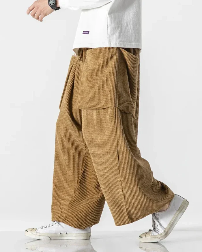 Tan wide-leg corduroy cargo pants shown in a side view