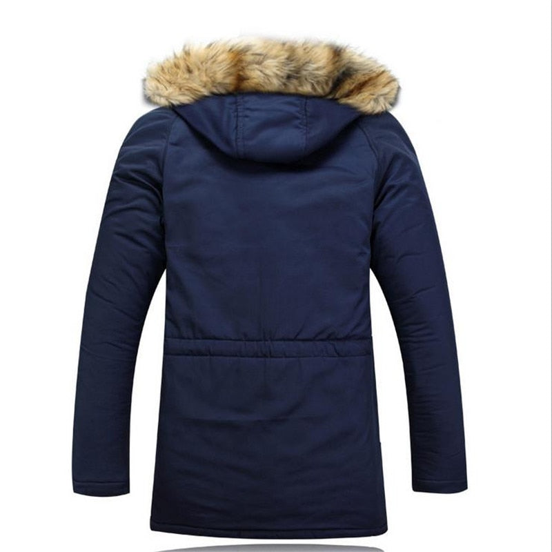Navy blue cotton-padded parka featuring a mid-thigh silhouette and a drawstring hood with plush faux-fur trim.