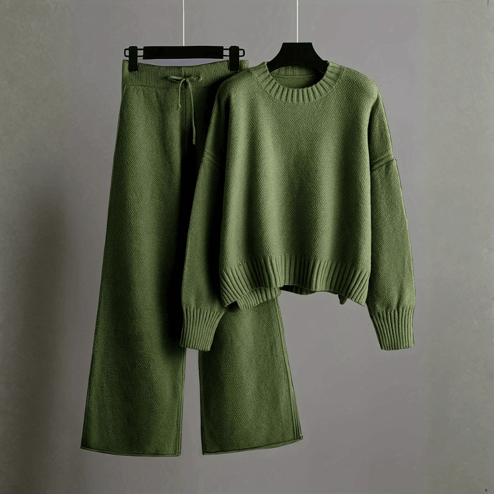Product hanging view of the relaxed crewneck knit sweater and matching wide-leg trousers set in olive green.