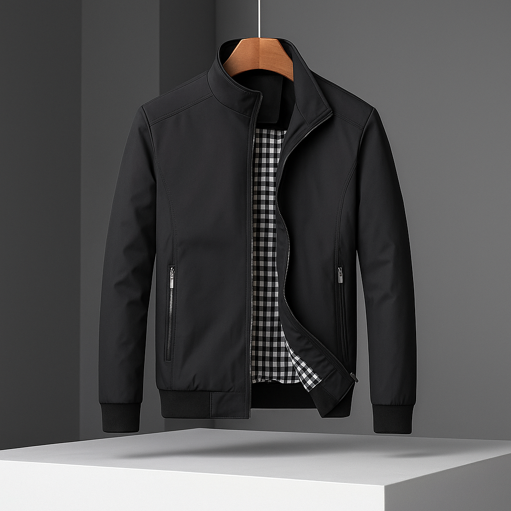 Black weather-resistant bomber jacket with a stand collar, zippered pockets, and a contrasting gingham-check lining.