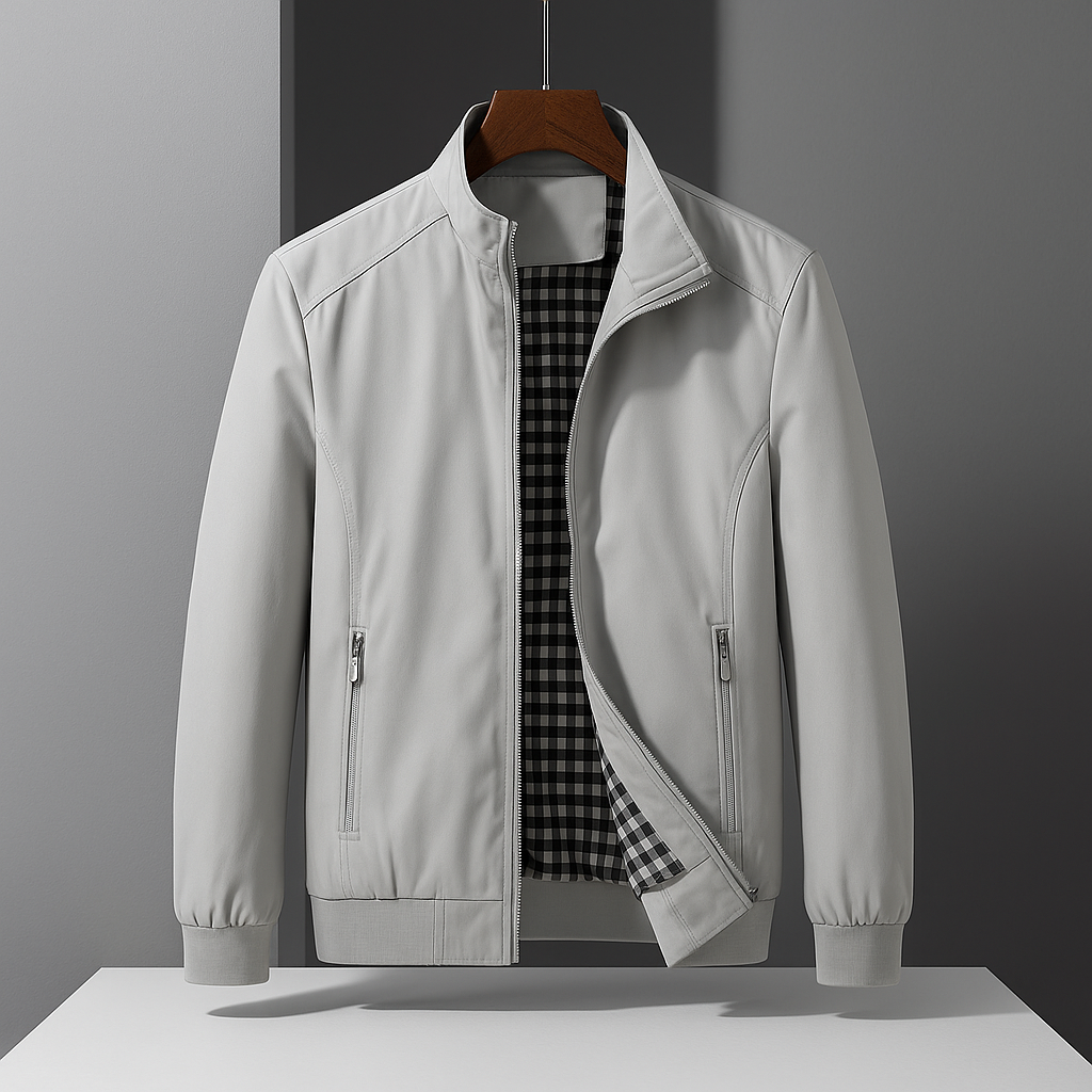 Light grey weather-resistant bomber jacket with a zip front and black-and-white gingham interior lining.