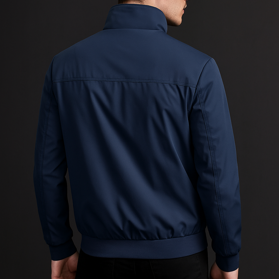 Navy blue weather-resistant bomber jacket with a structured fit and clean back yoke detail on a dark background.