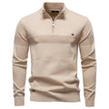 Beige quarter-zip knit sweater featuring a textured horizontal chest stripe, stand collar, and ribbed cuffs on a white background.