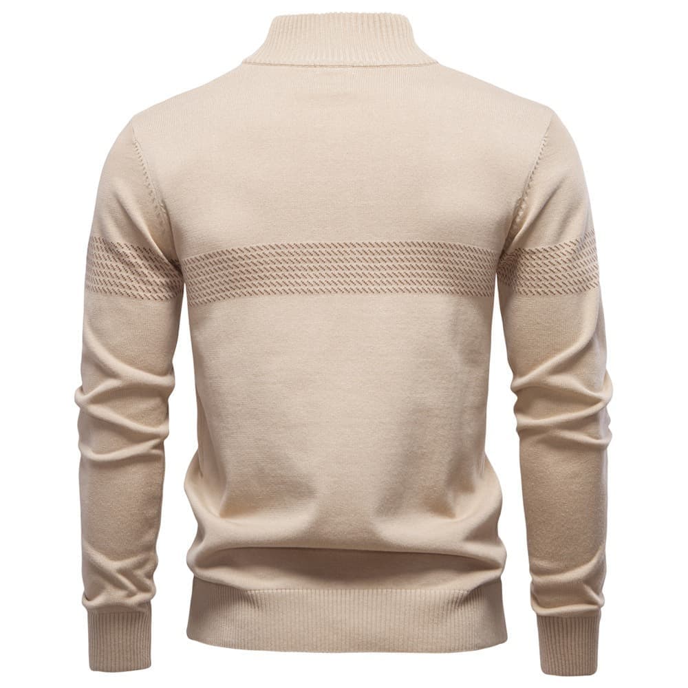 Back view of a beige quarter-zip knit sweater with a stand collar, textured upper back panel, and ribbed hem on a white background.