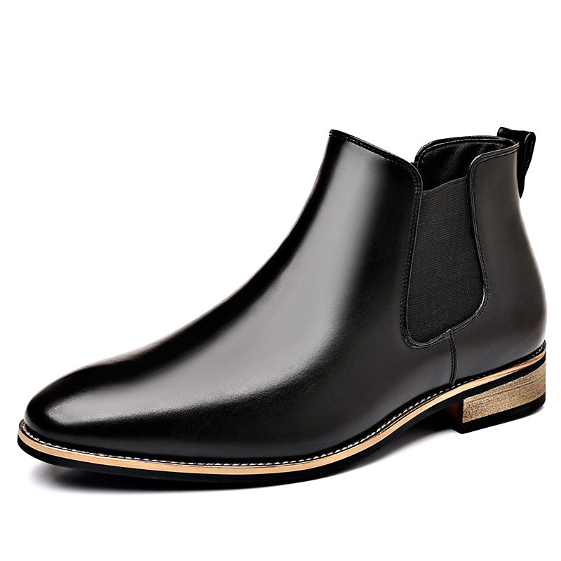 Burnished black leather Chelsea boot with a pointed toe, elastic side panels, stitched welt, and a low stacked heel.