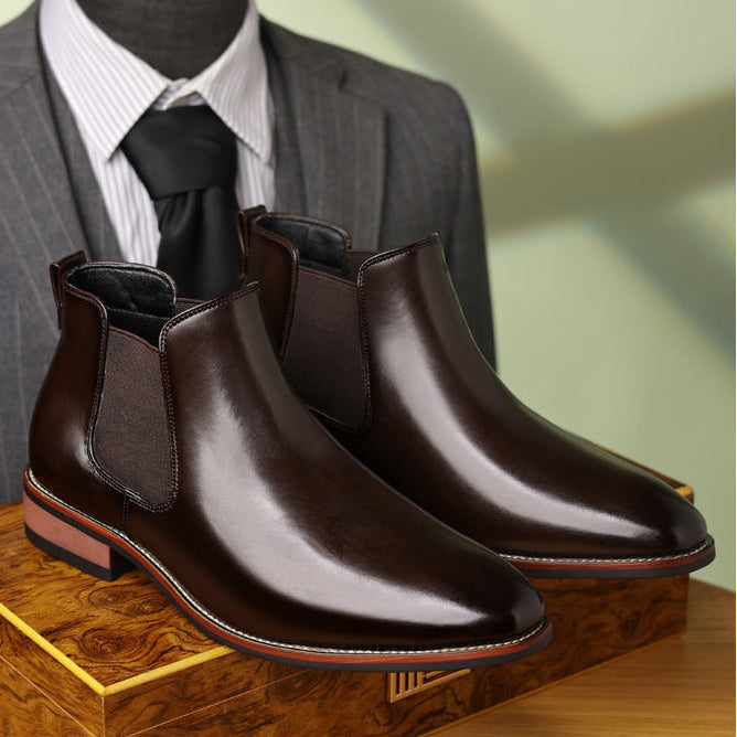 Burnished dark brown leather Chelsea boots with a pointed toe, elastic side panels, and a low stacked heel.
