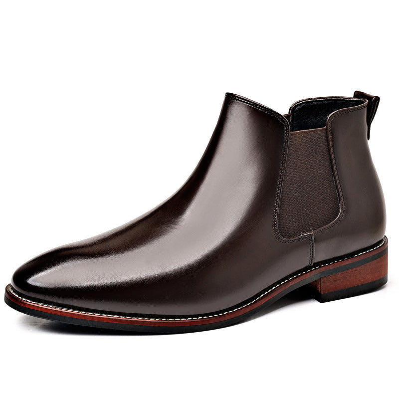 Burnished dark brown leather Chelsea boot with a pointed toe, elastic side panels, stitched welt, and stacked heel.