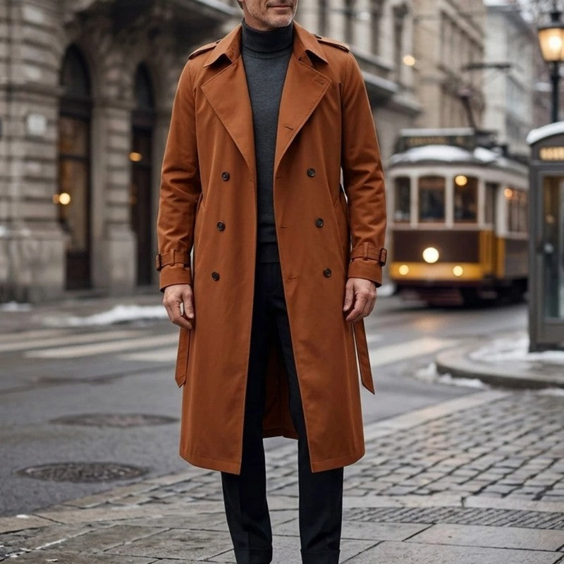 Orange Double-Breasted Longline Trench Coat worn outdoors, featuring a belted waist, notch lapels, double-breasted button front, and belted cuffs.