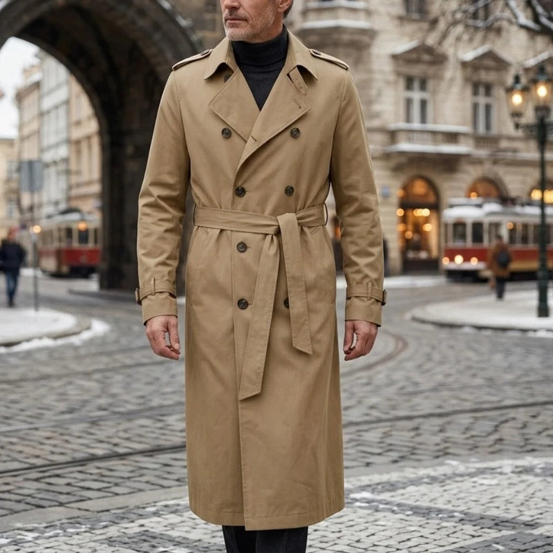 Beige Double-Breasted Longline Trench Coat worn outdoors, featuring a belted waist, notch lapels, double-breasted button front, and belted cuffs.