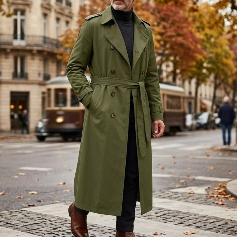 Olive green Double-Breasted Longline Trench Coat worn outdoors, featuring a belted waist, notch lapels, double-breasted button front, and belted cuffs.