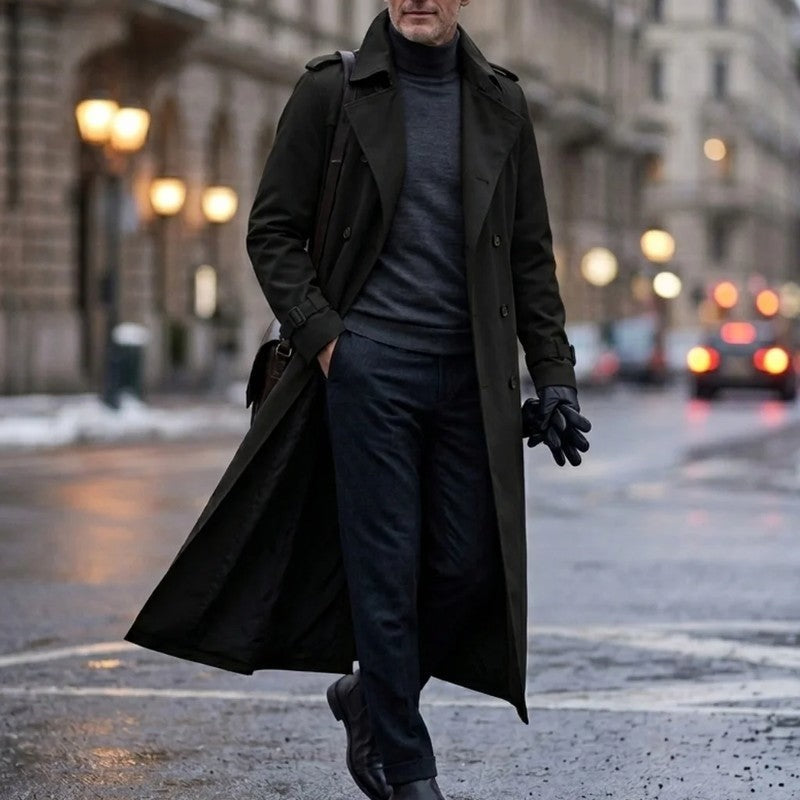 Black Double-Breasted Longline Trench Coat worn by a male model, featuring a belted waist, notch lapels, long sleeves, and smooth woven lining.