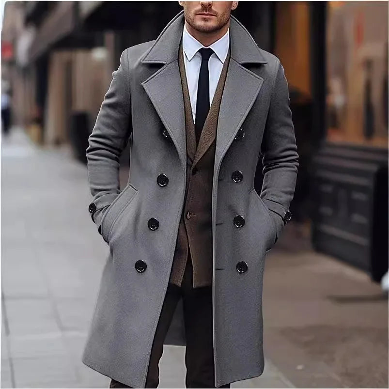 Gray Double-Breasted Midi Trench Coat worn by a male model outdoors, featuring wide notch lapels, double-breasted button front, side pockets, and a tailored fit.