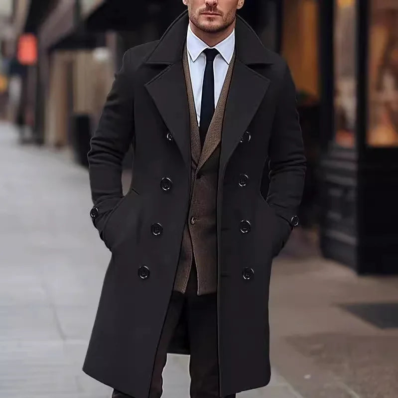 Black Double-Breasted Midi Trench Coat worn by a male model outdoors, featuring wide notch lapels, double-breasted button front, side pockets, and a tailored silhouette.