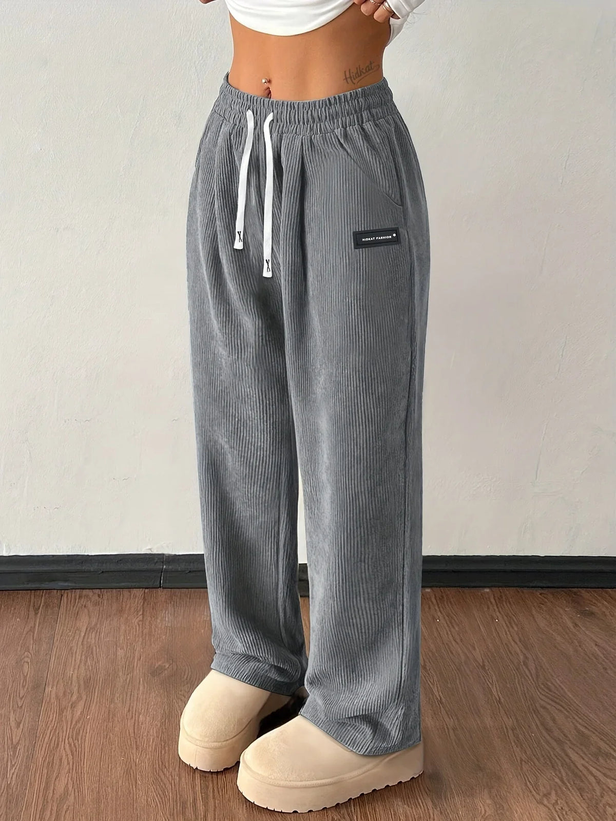 Gray wide-leg corduroy pants with elastic high waist and side pocket